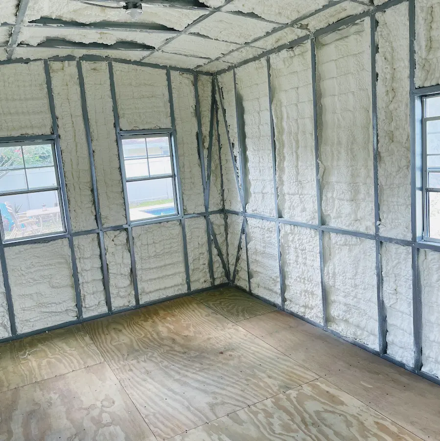 Closed-cell spray foam insulation applied to wall cavities in a residential project in Caledonia